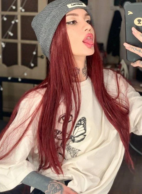 Does red hair color suit me better than black? Like it if yes.