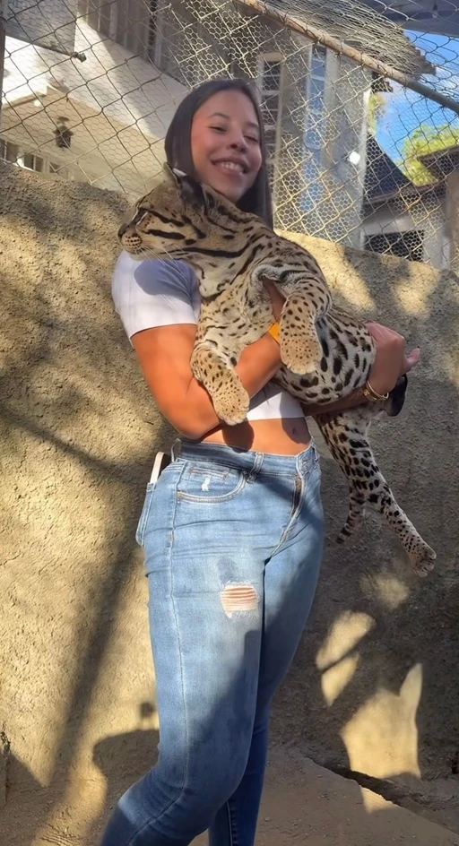 Holding a leopard but trust me, I bite harder 😏🐆 Who’s brave enough to test me?