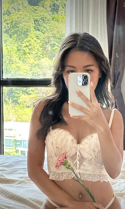 Caught myself in the reflection with a flower and a smile. Just a day, but there's something special about it. 🌸🌷Want to know what?